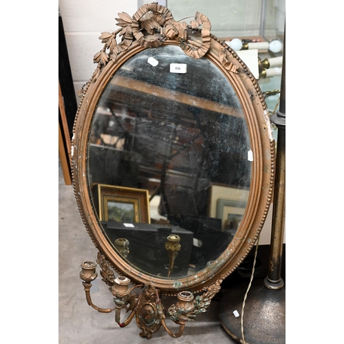 496 - An antique oval gilt-framed girandole mirror with three sconces, 88 x 58cm (a/f)