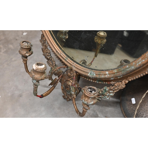 496 - An antique oval gilt-framed girandole mirror with three sconces, 88 x 58cm (a/f)