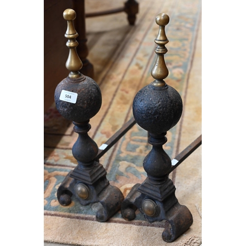 504 - A pair of Regency-style cast iron fire dogs