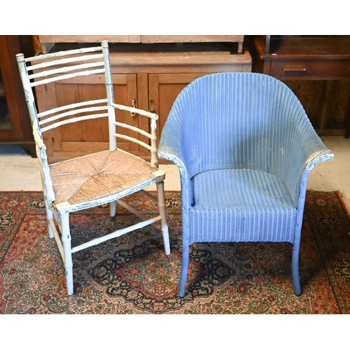 516 - A blue-painted Lloyd Loom armchair, to/w a simulated bamboo armchair with rush seat (2)