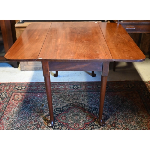 517 - # A mahogany drop-leaf dining table on turned supports and pad feet, 110 x 101cm