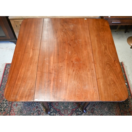 517 - # A mahogany drop-leaf dining table on turned supports and pad feet, 110 x 101cm