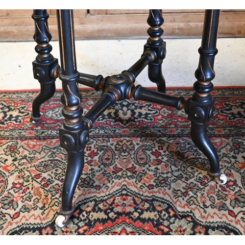 520 - Octagonal 'Gypsy' table with red velvet top on ebonised and gilded base, 55cm,