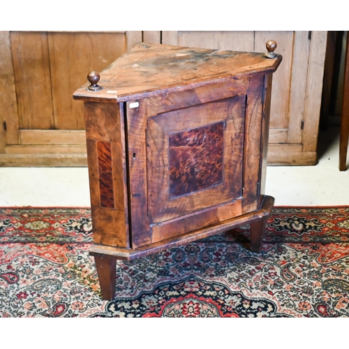 524 - # An inlaid Arts & Crafts part carved corner cupboard (af), 43cm wide