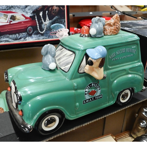 74 - Three boxes of novelty ceramic model vehicles - some boxed - including money boxes, decanters etc (3... 