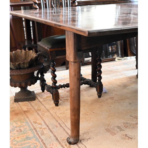 401 - A mahogany extending dining table with drop leaf top and three leaves on turned pad-footed supports,... 