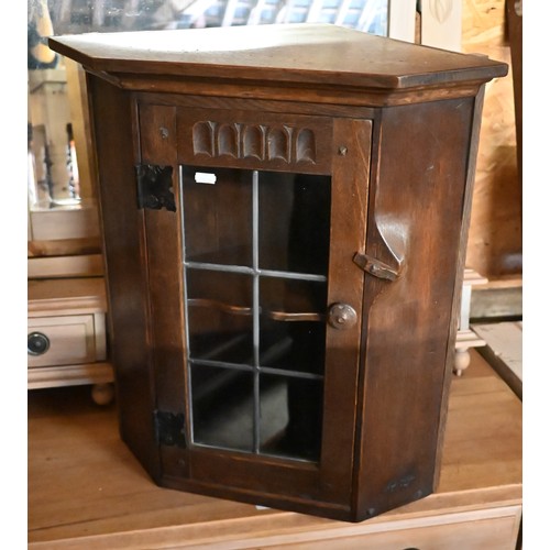 523 - A small oak corner cupboard with glazed door35 x 37 x 57cm H