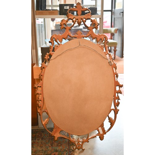 480 - A pair of oval gilt-framed mirrors with floral decorative framed 115 x 68cm