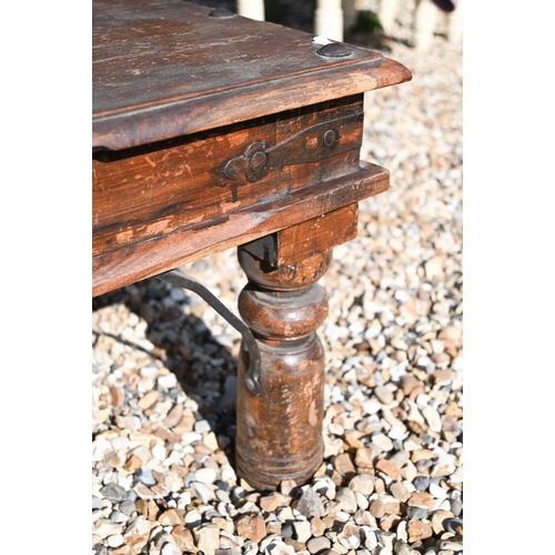 25 - An Indian hardwood iron mounted Thakat coffee table, 110 cm wide x 60 cm deep x 40 cm high