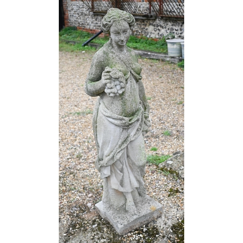 420 - A weathered cast stone garden statue of a classical maiden