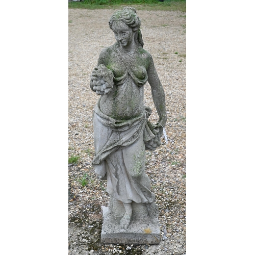 420 - A weathered cast stone garden statue of a classical maiden