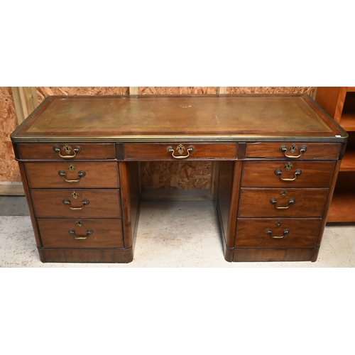 110 - A 19th century mahogany and brass mounted twin pedestal desk with gilt tooled green leather top over... 