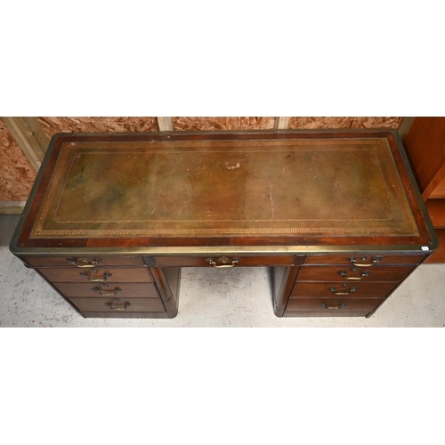 110 - A 19th century mahogany and brass mounted twin pedestal desk with gilt tooled green leather top over... 