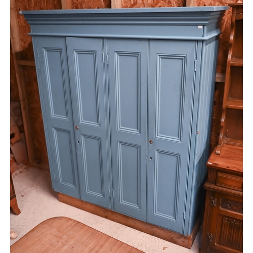 114 - A blue painted compactum wardrobe with two pairs of panelled doors, 140 cm wide x 48 cm deep x 174 c... 