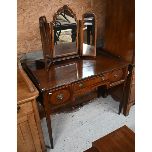 116 - # A mahogany dressing table with three drawers, on tapering square supports, 106 cm wide x 56 cm dia... 