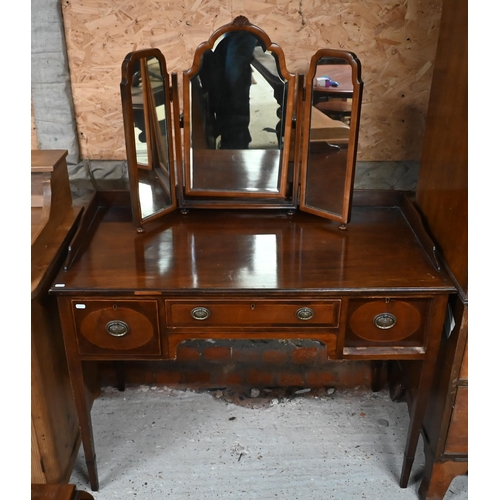 116 - # A mahogany dressing table with three drawers, on tapering square supports, 106 cm wide x 56 cm dia... 