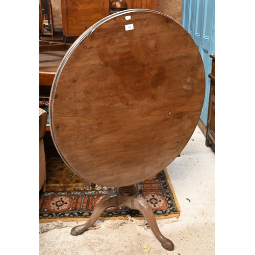 122 - A 19th century mahogany circular tilt-top table on tripod base with turned column, 82 cm diam