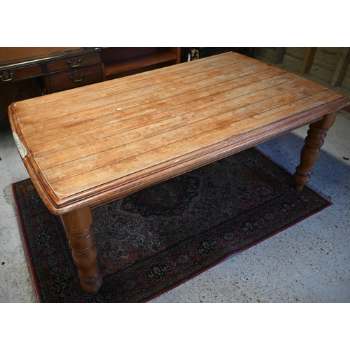 123 - A French hardwood dining table with moulded top on turned supports, 175 x 104 x 75 cm high