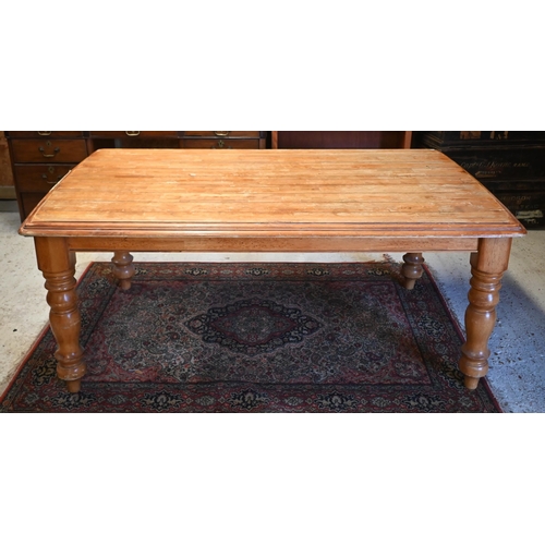 123 - A French hardwood dining table with moulded top on turned supports, 175 x 104 x 75 cm high