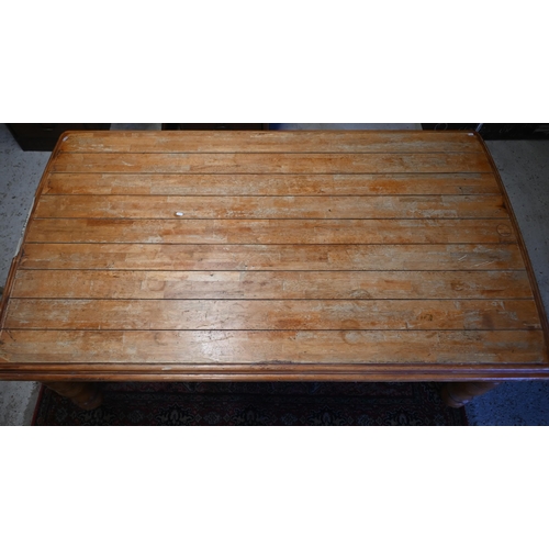 123 - A French hardwood dining table with moulded top on turned supports, 175 x 104 x 75 cm high