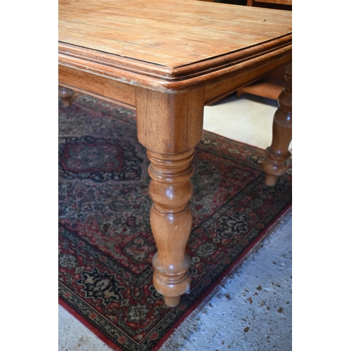 123 - A French hardwood dining table with moulded top on turned supports, 175 x 104 x 75 cm high