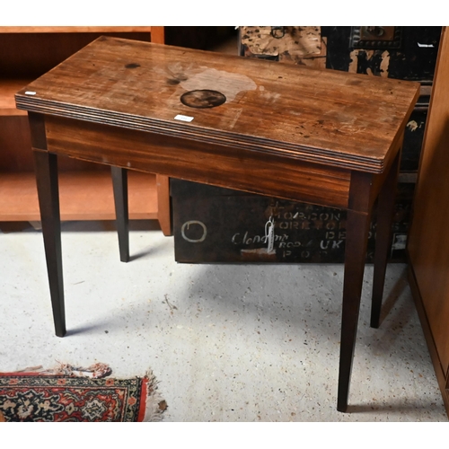 131 - # A 19th century mahogany folding tea table on tapering square supports, 86 cm wide x 42 cm deep x 7... 