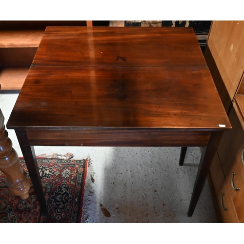 131 - # A 19th century mahogany folding tea table on tapering square supports, 86 cm wide x 42 cm deep x 7... 