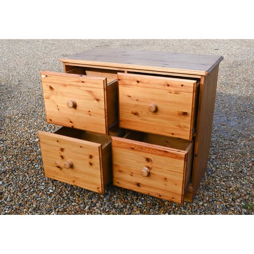 133 - A stained pine four drawer filing chest, 100 cm x 50 cm x 86 cm high