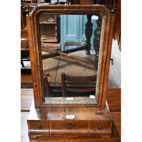 134 - A 19th century walnut toilet mirror on three drawer platform base