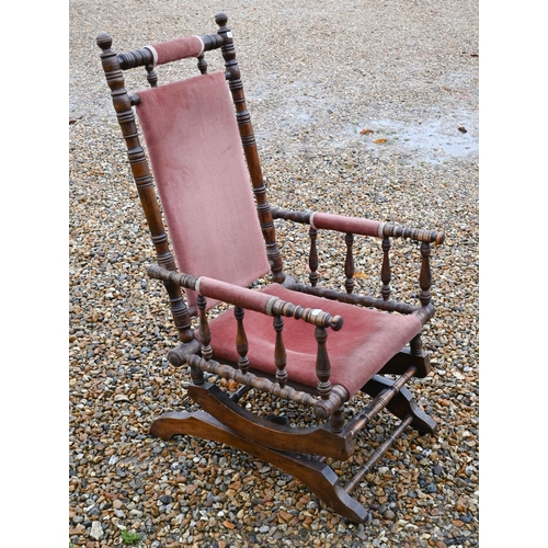 141 - A walnut framed Amercian rocking chair