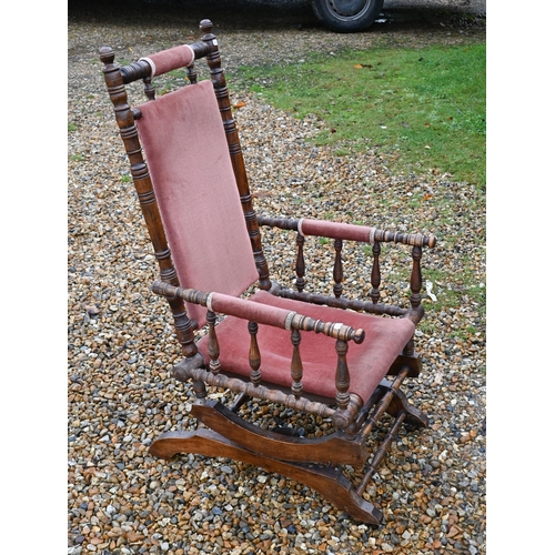 141 - A walnut framed Amercian rocking chair