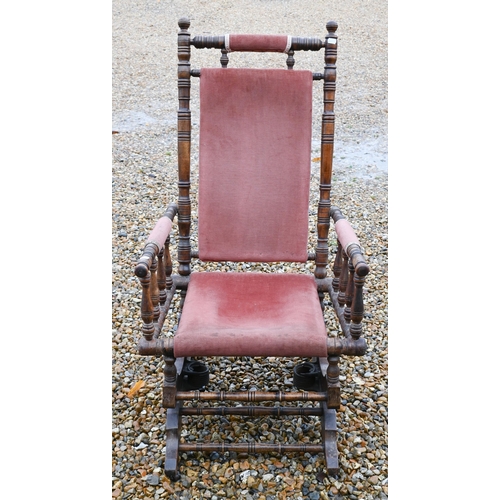 141 - A walnut framed Amercian rocking chair