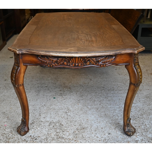 142 - # A French oak carved walnut dining table with shaped rectangular top, 180 cm x 100 x 76 cm