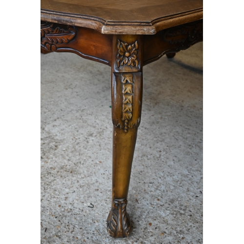 142 - # A French oak carved walnut dining table with shaped rectangular top, 180 cm x 100 x 76 cm