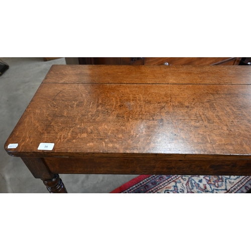 16 - An antique oak side table with drawer to one end, raised on turned supports, 92 cm x 46 x 82 cm high