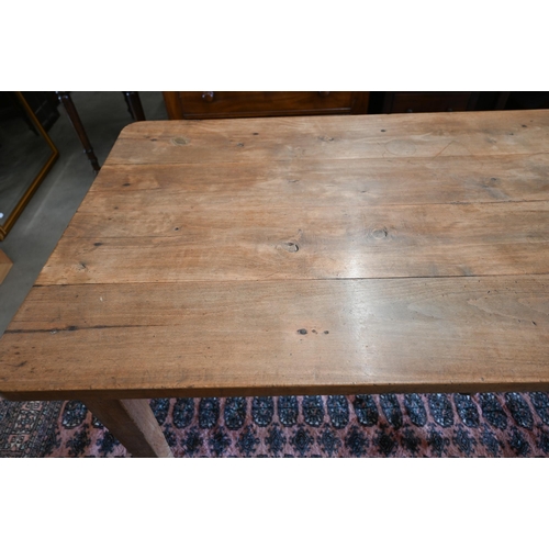 18 - A provincial French fruitwood kitchen dining table, the four plank rectangular top with single friez... 