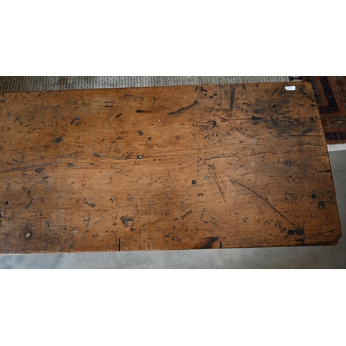27 - An antique French elm and fruitwood rustic workbench on block trestle supports, 200 cm wide x 40 cm ... 