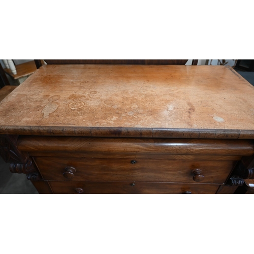 3 - A large Victorian mahogany chest of drawers with cavetto drawer over four standard drawers, on bun f... 