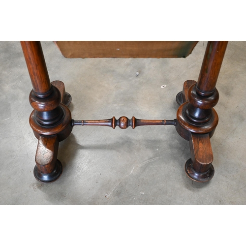 30 - A Victorian rosewood folding sewing table with compartmentalised drawer and wool box on twin column ... 