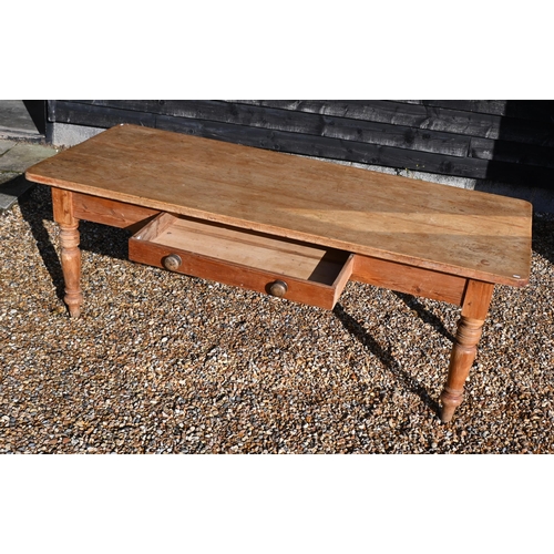 31 - A vintage pine farmhouse dining table with single drawer and turned supports, 214 cm wide x 90 cm de... 