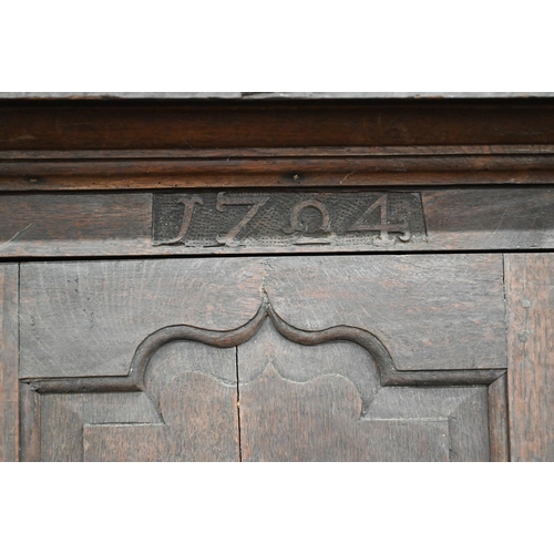 34 - An 18th century and later oak livery cupboard with panelled doors on base with two drawers below dum... 