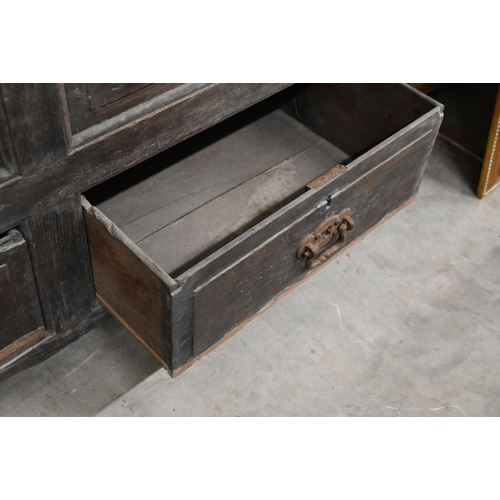 34 - An 18th century and later oak livery cupboard with panelled doors on base with two drawers below dum... 