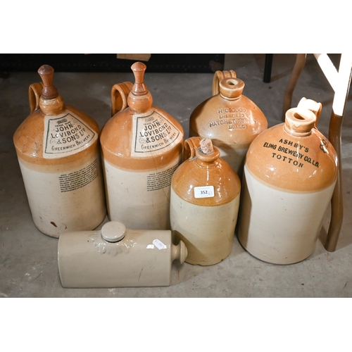 A pair of antique stoneware one gallon flagons, printed for John Lovibond & Sons Greenwich Brewery, to/w two others - The Hatchet, Sherfield and Ashby's Eling Brewery, Totton, an unmarked half gallon flagon and a hot water bottle (6)