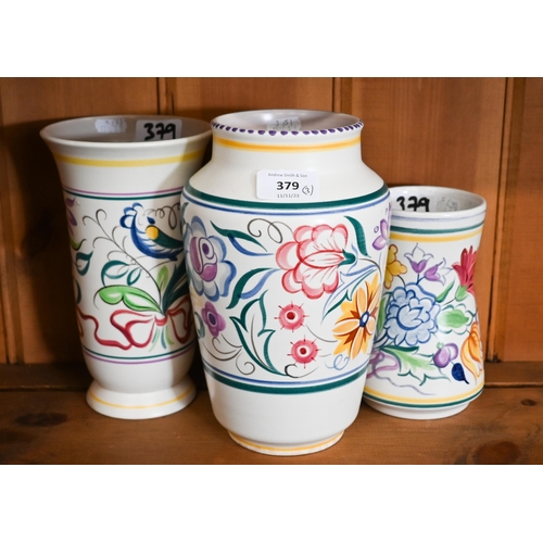 Three floral-painted Poole pottery vases, 22 - 16 cm