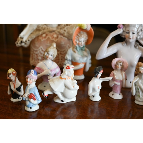 400 - A collection of vintage china pin-cushion figures and reclining female figures, etc