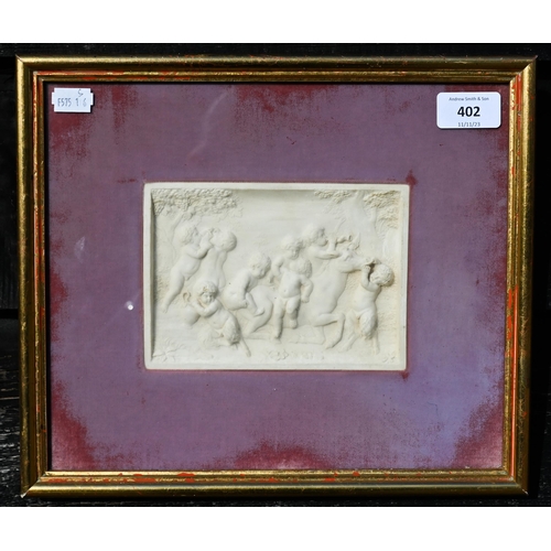 402 - A framed relief plaque depicting Bacchanalian putti, 11 x 16 cm