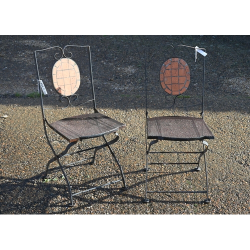 410 - A circular metal terrace table (100 cm diam) and c/w two tile backed folding chairs