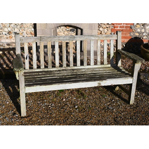 411 - A weathered teak slatted garden bench, 160 cm wide