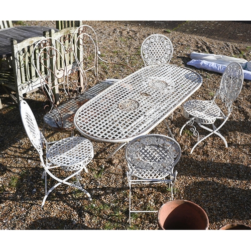 413 - A painted metal lattice-work patio set comprising table, four chairs, two parasols to/w painted wrou... 