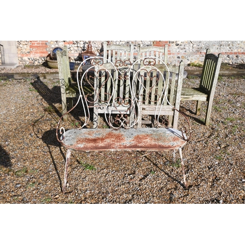 413 - A painted metal lattice-work patio set comprising table, four chairs, two parasols to/w painted wrou... 